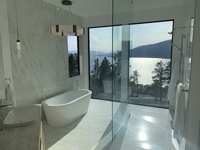 Dream bathroom - custom curbless shower with large format tile and tiled linear drain (+ that view!)